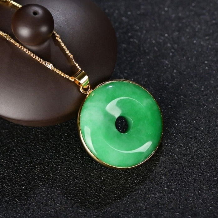 Carved Natural Green Jade Doughnut Pendant