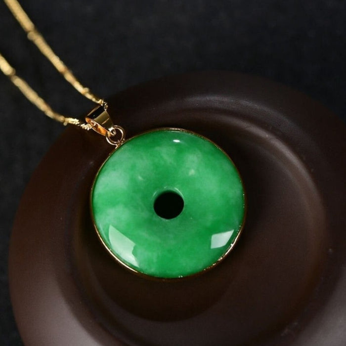 Carved Natural Green Jade Doughnut Pendant
